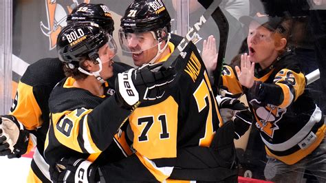 Malkin, Penguins surge past Flames with 5 goals in the third period for a 5-2 win